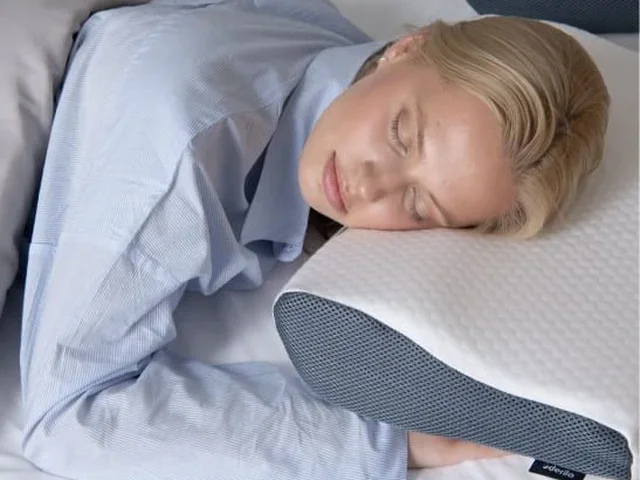 Derilla Memory Foam Pillow shown in a side-sleeping context